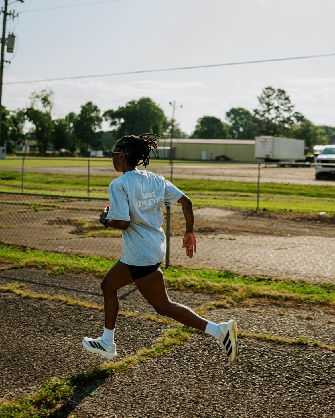 Rare Athletics athlete running on track