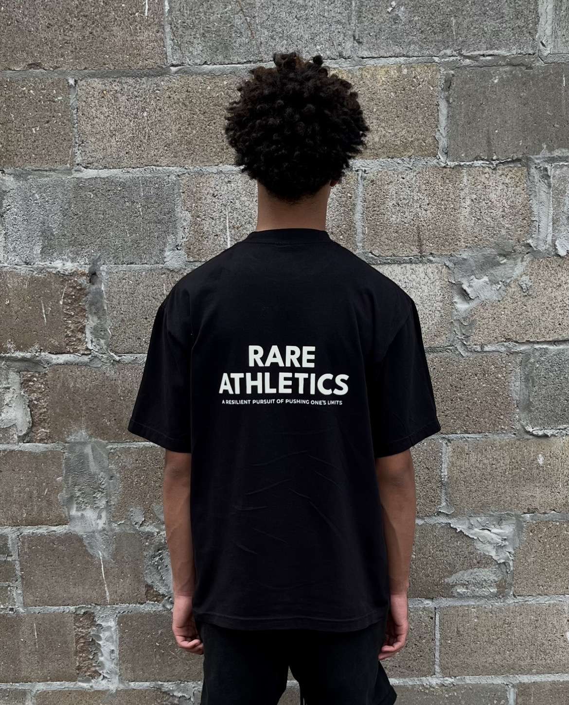 Model wearing Rare Athletics heavyweight cotton tee
